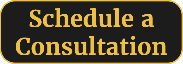 Schedule a Consultation Black button with yellow text reading "Schedule a Consultation."