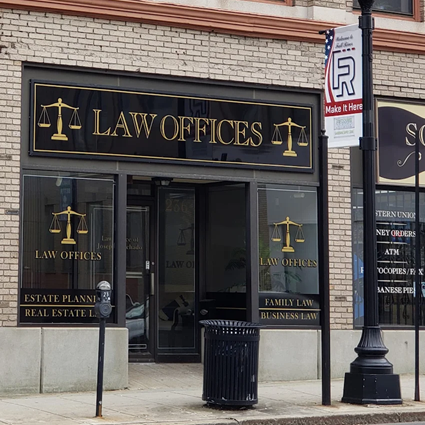 Law Office Front of Machado Law Group, P.C.'s office with gold lettering and window signage.